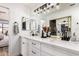 Beautiful bathroom featuring a large vanity with dual sinks and a modern lighting fixture at 10080 E Mountainview Lake Dr # 327, Scottsdale, AZ 85258