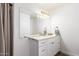 This bathroom features a dual sink vanity with granite countertops and modern fixtures at 10080 E Mountainview Lake Dr # 327, Scottsdale, AZ 85258