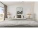 Spacious bedroom with decorative lamps and soft, inviting bedding at 10080 E Mountainview Lake Dr # 327, Scottsdale, AZ 85258