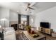 Living area showcasing a fireplace, comfortable seating, and access to an outdoor patio at 10080 E Mountainview Lake Dr # 327, Scottsdale, AZ 85258