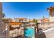 Community pool view from a balcony with tile roofs and lush landscaping at 10080 E Mountainview Lake Dr # 327, Scottsdale, AZ 85258