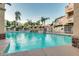 Relaxing community pool with lush landscaping and comfortable lounge chairs at 10080 E Mountainview Lake Dr # 327, Scottsdale, AZ 85258