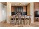 Entertain in style at this elegant bar featuring stone accents, rich wood cabinetry, and comfortable seating at 11986 N 134Th Pl, Scottsdale, AZ 85259