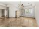 Spacious bedroom with tile flooring, ceiling fan, and access to the patio at 11986 N 134Th Pl, Scottsdale, AZ 85259