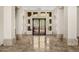 Spacious home foyer with stone floors, high ceilings, and decorative windows at 11986 N 134Th Pl, Scottsdale, AZ 85259