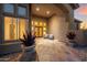 Inviting front entrance with tiled walkway, desert landscaping, and a cozy seating area at 11986 N 134Th Pl, Scottsdale, AZ 85259