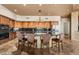 Gourmet kitchen boasts a large island with seating and stainless steel appliances at 11986 N 134Th Pl, Scottsdale, AZ 85259