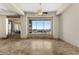 Large living room featuring travertine floors and backyard pool views at 11986 N 134Th Pl, Scottsdale, AZ 85259