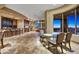 Spacious open-concept living room with a bar, fireplace, and beautiful views at 11986 N 134Th Pl, Scottsdale, AZ 85259