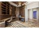 Executive office with custom shelving, travertine floors, and natural light at 11986 N 134Th Pl, Scottsdale, AZ 85259