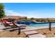 Beautiful pool and spa with lounge chairs on a sunny day at 11986 N 134Th Pl, Scottsdale, AZ 85259