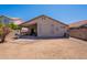 View of the home's back exterior with patio and yard at 12208 N 41St Ln, Phoenix, AZ 85029