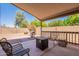 Covered patio with outdoor seating and a barbecue grill at 12208 N 41St Ln, Phoenix, AZ 85029