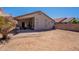 Home's rear exterior with patio and spacious backyard area at 12208 N 41St Ln, Phoenix, AZ 85029