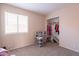 Neutral toned bedroom with a window, closet, and toys at 12208 N 41St Ln, Phoenix, AZ 85029
