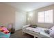 Cozy bedroom with carpet, a white framed twin bed, and a sliding door closet at 12208 N 41St Ln, Phoenix, AZ 85029