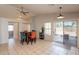 Open-concept dining area with tile flooring and a dining table with chairs at 12208 N 41St Ln, Phoenix, AZ 85029
