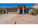 Inviting single-story home featuring a red tile roof, low maintenance landscaping, and a two-car garage at 12208 N 41St Ln, Phoenix, AZ 85029
