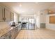 Bright kitchen featuring stainless steel appliances, tile floors, and granite countertops at 12208 N 41St Ln, Phoenix, AZ 85029