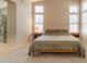 Spacious main bedroom featuring plush carpet, two windows, and bedside tables at 12208 N 41St Ln, Phoenix, AZ 85029