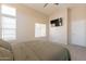 Bright main bedroom features plush carpet, high ceilings, and bright natural light at 12208 N 41St Ln, Phoenix, AZ 85029