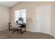 Well-lit office space with a desk, chair, computer, and a window for natural light at 12208 N 41St Ln, Phoenix, AZ 85029