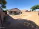 Large backyard space offers endless possibilities for outdoor living and entertainment at 12934 W Voltaire Ave, El Mirage, AZ 85335