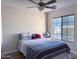 Comfortable bedroom features a ceiling fan and a window that provides natural light at 12934 W Voltaire Ave, El Mirage, AZ 85335
