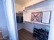 Walk-in closet with shelving, hanging rods and a shoe rack for storage solutions at 12934 W Voltaire Ave, El Mirage, AZ 85335