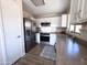 Well-equipped kitchen featuring stainless appliances, white cabinetry, and ample counter space, perfect for cooking enthusiasts at 12934 W Voltaire Ave, El Mirage, AZ 85335