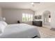 This spacious bedroom offers plush carpeting, a mounted television, and a bathroom featuring a soaking tub at 13993 N 102Nd St, Scottsdale, AZ 85260