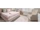 Cozy bedroom with a stuffed animal basket, a neutral-toned bed, and a comfy chair by the window at 13993 N 102Nd St, Scottsdale, AZ 85260