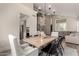 Bright dining area open to the living room with modern chandelier and staircase at 13993 N 102Nd St, Scottsdale, AZ 85260