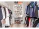 Walk-in closet with an organized storage system for shoes and clothing at 13993 N 102Nd St, Scottsdale, AZ 85260