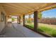 A large backyard with a covered patio extends from a yard and is perfect for outdoor gatherings at 1407 W Utopia Rd, Phoenix, AZ 85027
