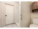 Standard bathroom with tile floors, shower, toilet, and cabinet at 1407 W Utopia Rd, Phoenix, AZ 85027