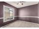 Standard bedroom with carpeted floors, paint, and windows at 1407 W Utopia Rd, Phoenix, AZ 85027