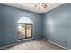 Bedroom with carpet, fan, window, and blue walls at 1407 W Utopia Rd, Phoenix, AZ 85027