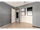 Bedroom with tile floors, built-in storage, and a glimpse into another room at 1407 W Utopia Rd, Phoenix, AZ 85027