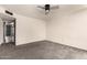 Inviting bedroom with carpet flooring, ceiling fan, and ample closet space at 1407 W Utopia Rd, Phoenix, AZ 85027