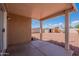 View of a shaded patio with a gravel yard and block fence at 14244 N 132Nd Ln, Surprise, AZ 85379
