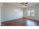 Well-lit bedroom with modern ceiling fan and window bringing in plenty of natural light at 14244 N 132Nd Ln, Surprise, AZ 85379