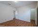 Open bedroom layout with wood floors and ensuite access offers flexibility and privacy at 14244 N 132Nd Ln, Surprise, AZ 85379