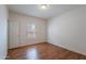 Sunlit bedroom with wood-look floors and a window offers a bright and inviting space at 14244 N 132Nd Ln, Surprise, AZ 85379