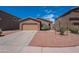 Charming single-story home features a two-car garage and desert landscaping for easy maintenance at 14244 N 132Nd Ln, Surprise, AZ 85379