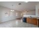 Open kitchen with tile floors, and adjacent dining area. A dishwasher is featured at 14244 N 132Nd Ln, Surprise, AZ 85379