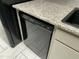A modern kitchen featuring a sleek black Frigidaire dishwasher and granite countertops at 14300 W Bell Rd # 57, Surprise, AZ 85374