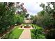Lush backyard featuring a fire pit with seating area and manicured landscaping, perfect for outdoor enjoyment at 14605 S 35 Pl, Phoenix, AZ 85044
