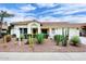 Charming single-story home featuring desert landscaping with cacti and a tile roof under a partly cloudy sky at 14605 S 35 Pl, Phoenix, AZ 85044
