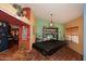 Game room featuring a covered pool table, custom paint, and a decorative star pendant light at 14605 S 35 Pl, Phoenix, AZ 85044